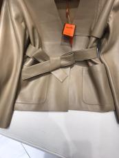 Hermes female open-front collarless leather jacket minimalist leather trench coat winter outwear windbreaker with pair of symmetrical slip pocket and waisted belt 