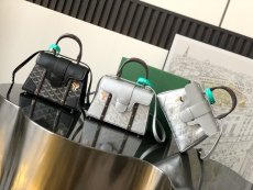 Goyard saigon PM structured top -handle handbag versatile cosmetic organizers trunk with studded feet 