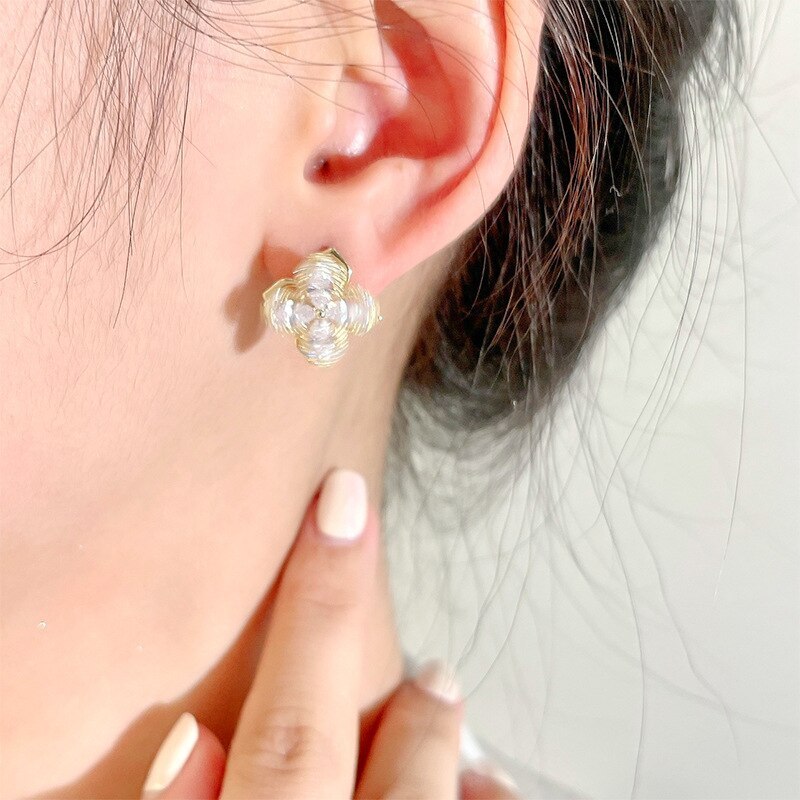 Sterling Silver Needle Rotating Four-Leaf Flower Stud Earrings Micro Inlaid Zircon Temperament Wild Flower Earrings