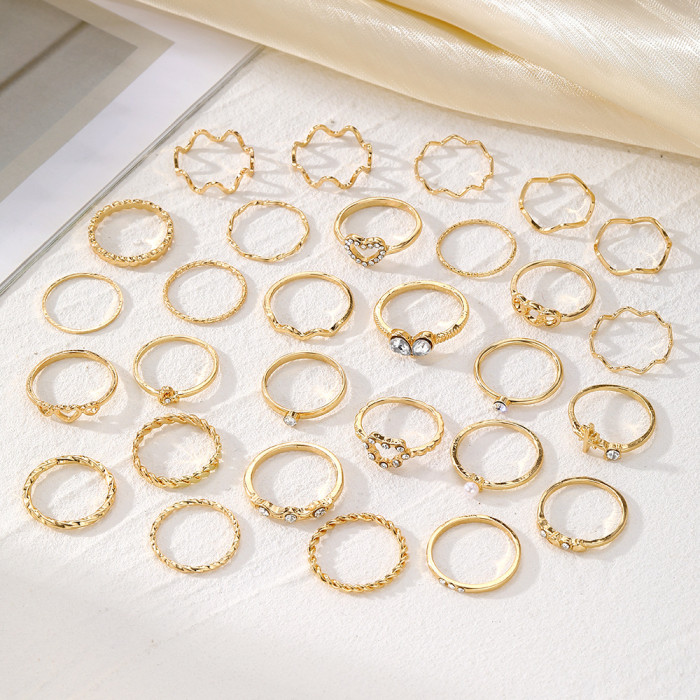 Hot Selling Simple Rhinestone Wave Love Ring 28-Piece Gold Joint Alloy Ring Set Bracelet for Women