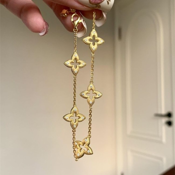 Vintage Style Antique Gold Brushed Hollow Four-Leaf Clover Earrings Retro High-End Light Luxury Diamond-Studded Flower Earrings for Women