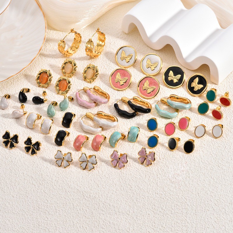 European and American Oil Drop Stainless Steel Earrings High-end Bowknot Personality Design Cat's Eye Stone Women's Stud Earrings Heart-shaped Crystal