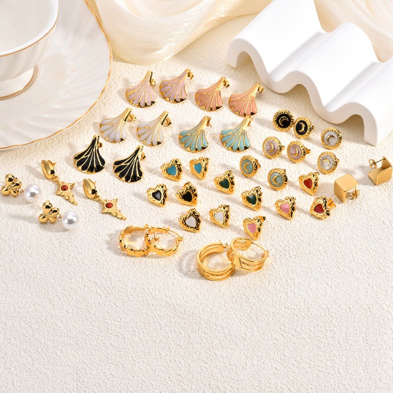 European and American Oil Drop Stainless Steel Earrings High-end Bowknot Personality Design Cat's Eye Stone Women's Stud Earrings Heart-shaped Crystal