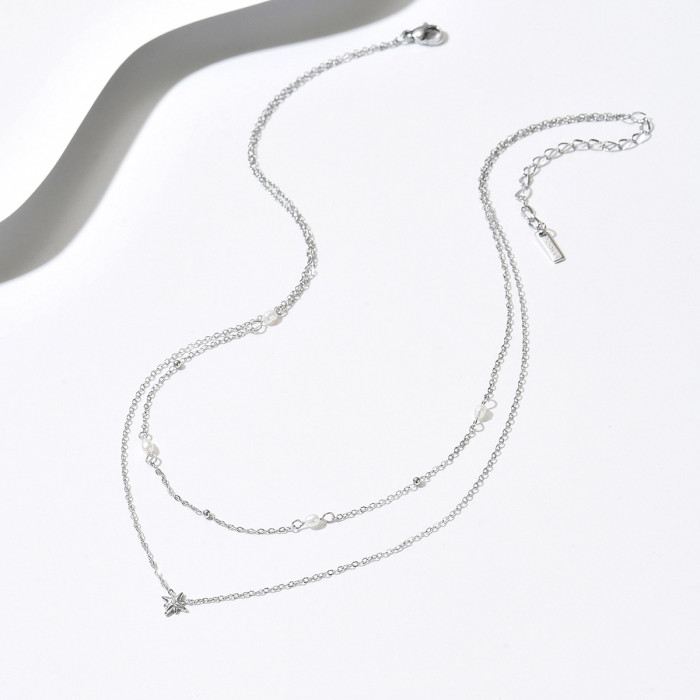 Layered starburst pearl titanium steel double-layer necklace in gold and silver, niche collarbone chain for everyday workplace elegance