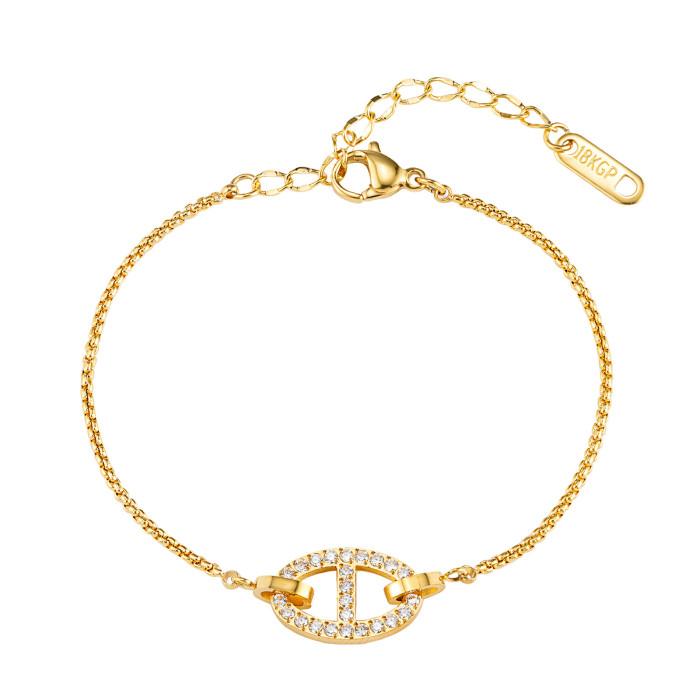 Diamond-embellished oval clasp fine chain bracelet in gold and steel two-tone + light luxury sparkling diamonds, unique clasp design, versatile and stylish