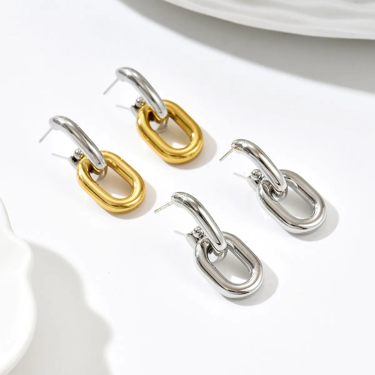 European and American minimalist geometric chain earrings, titanium steel two-tone spliced studs, niche design commuter earrings