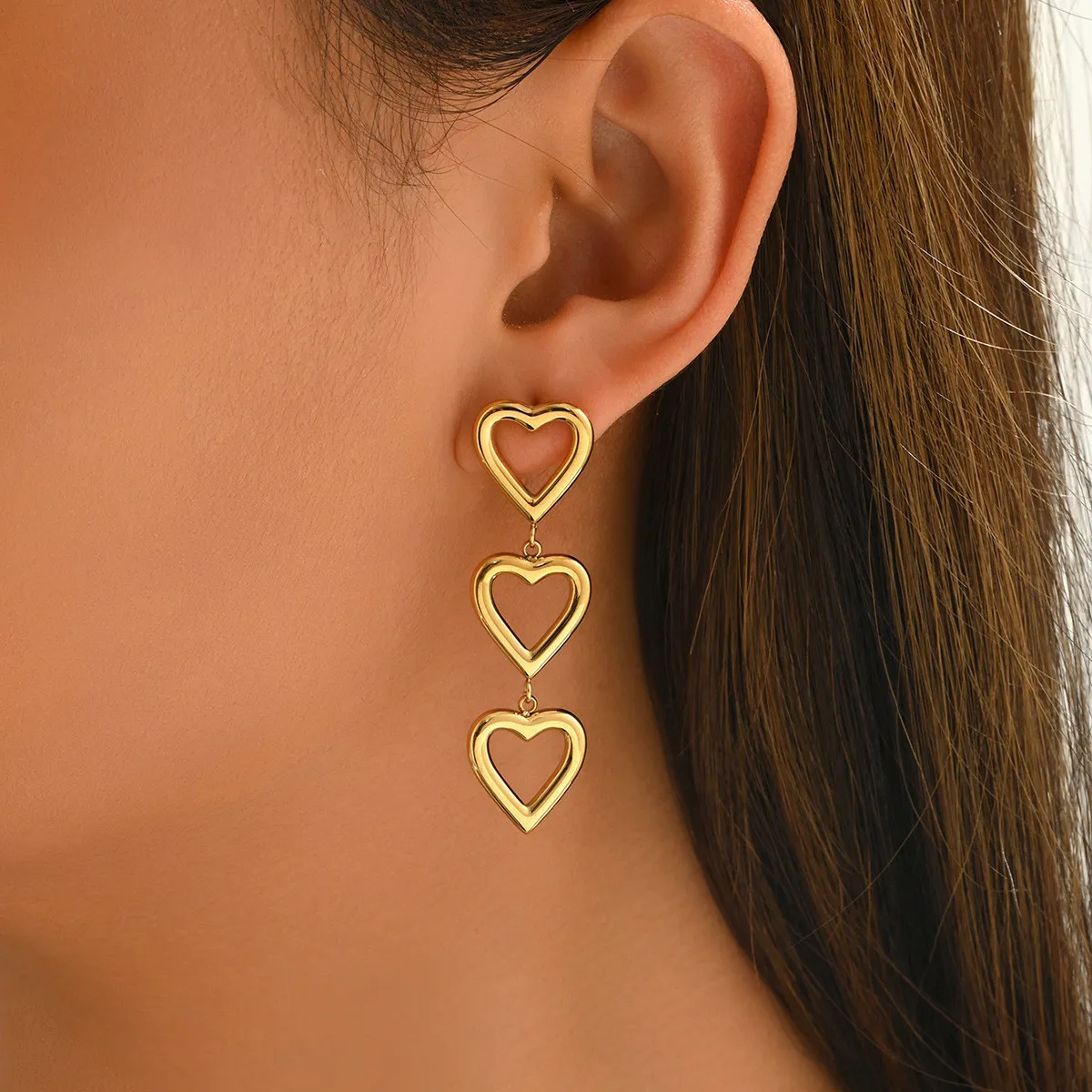 Sweet girl style three-layer heart earrings, gold-plated hollow heart earrings, unique design long earrings