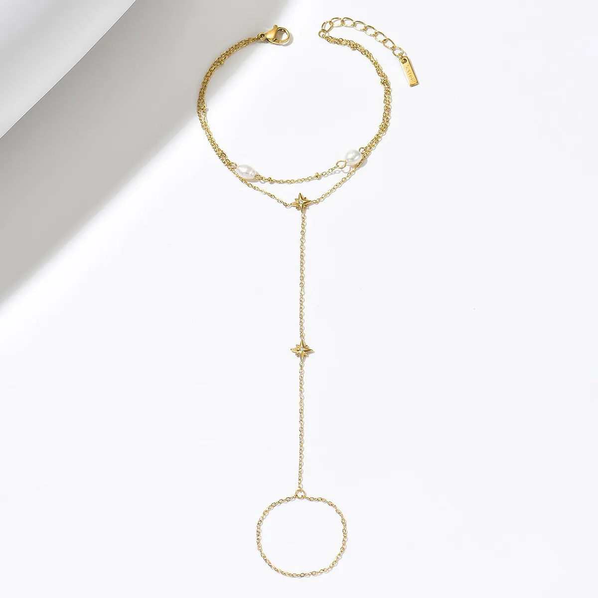 Cross-border ins light luxury gold-plated stainless steel hand chain with water drop zircon and freshwater pearl exquisite finger chain for women