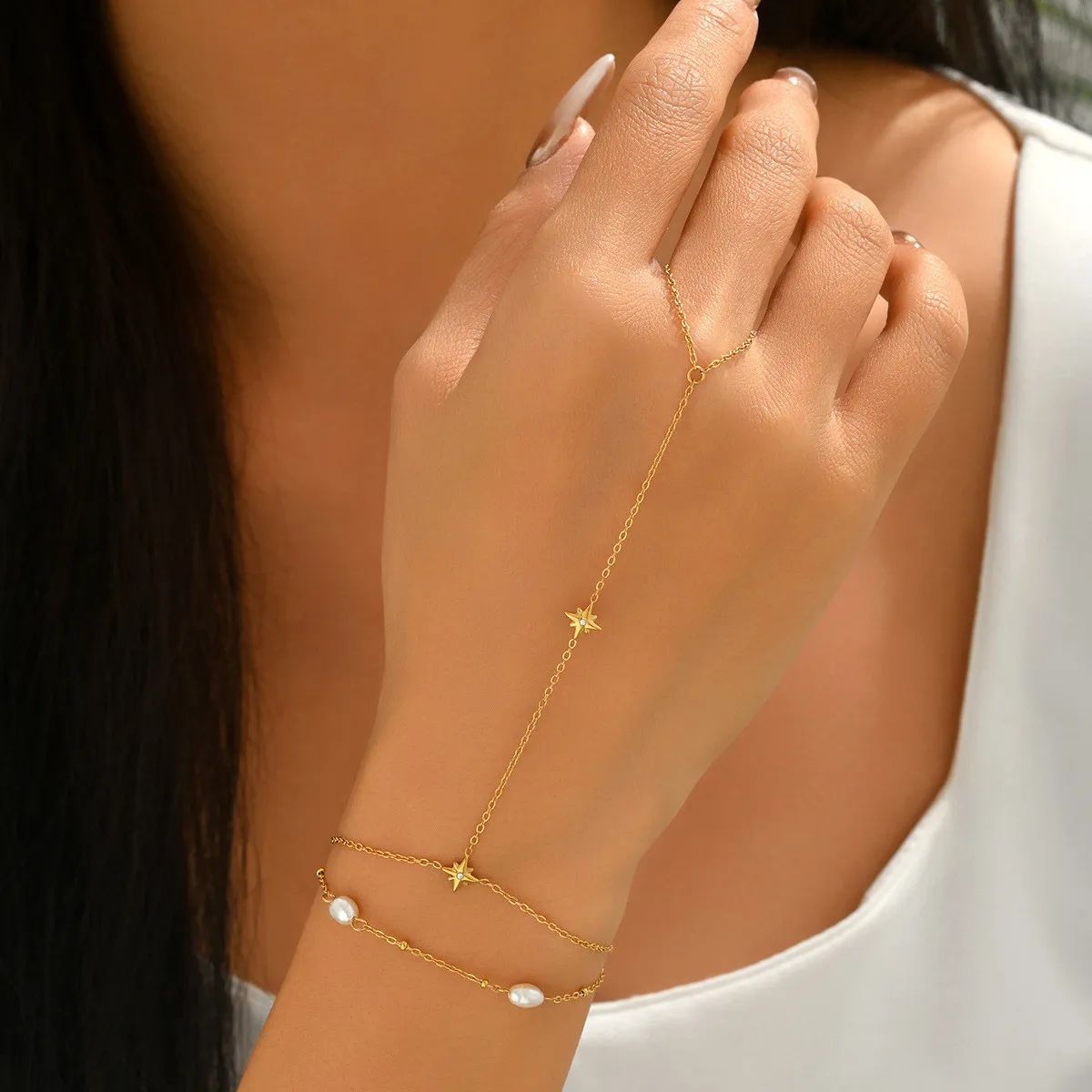 Cross-border ins light luxury gold-plated stainless steel hand chain with water drop zircon and freshwater pearl exquisite finger chain for women