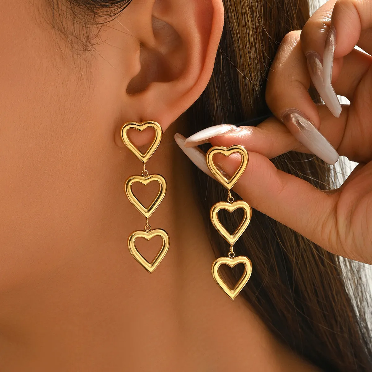 Sweet girl style three-layer heart earrings, gold-plated hollow heart earrings, unique design long earrings
