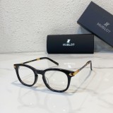 Elegant black-framed hublot eyeglasses on display H017O