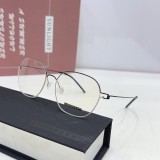 Sophisticated avant-garde glasses with gold-tone detailing FLB002