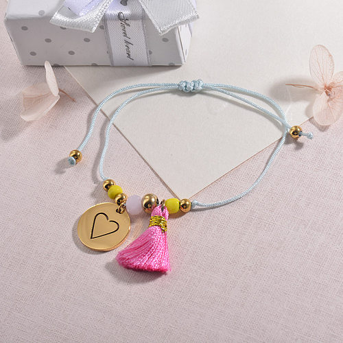 Trendy ethnic style beaded braided bracelet with round heart pendant