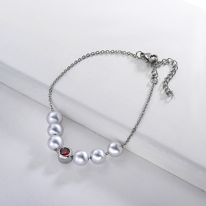 Stainless steel steel ball bracelet with red zircon pendant