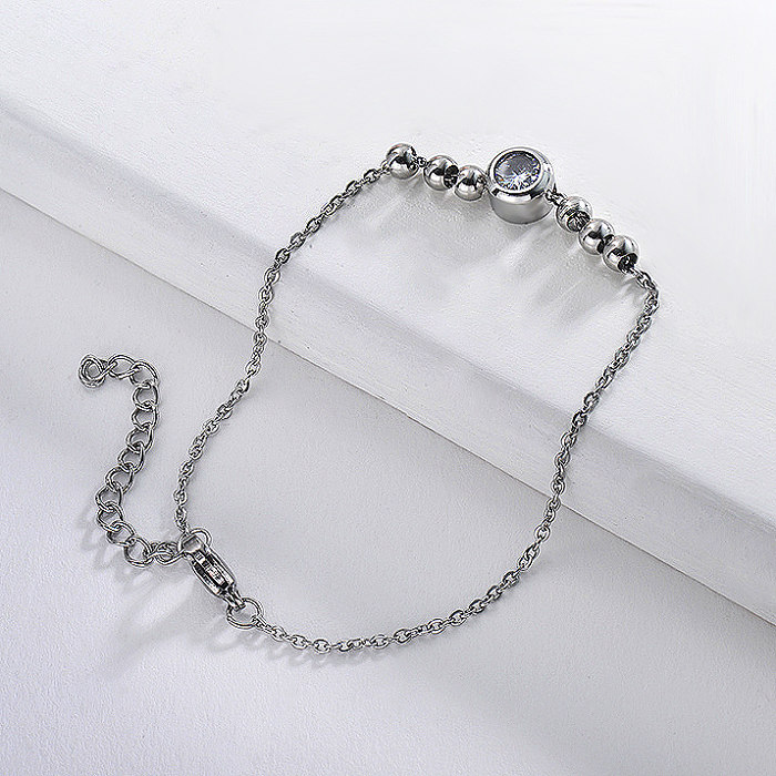 Stainless steel ball bracelet and white zircon pendant