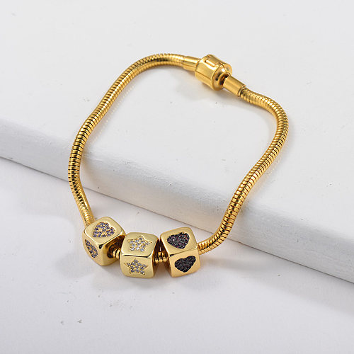 Golden stainless steel spring bracelet and pendant