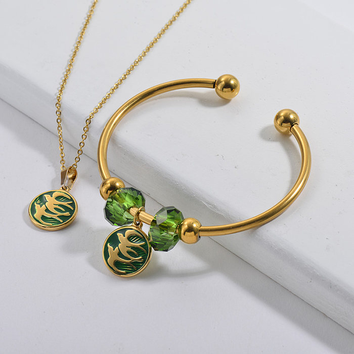 Conjunto de joyería de brazalete de collar de golondrina chapado en oro de marca famosa de acero inoxidable