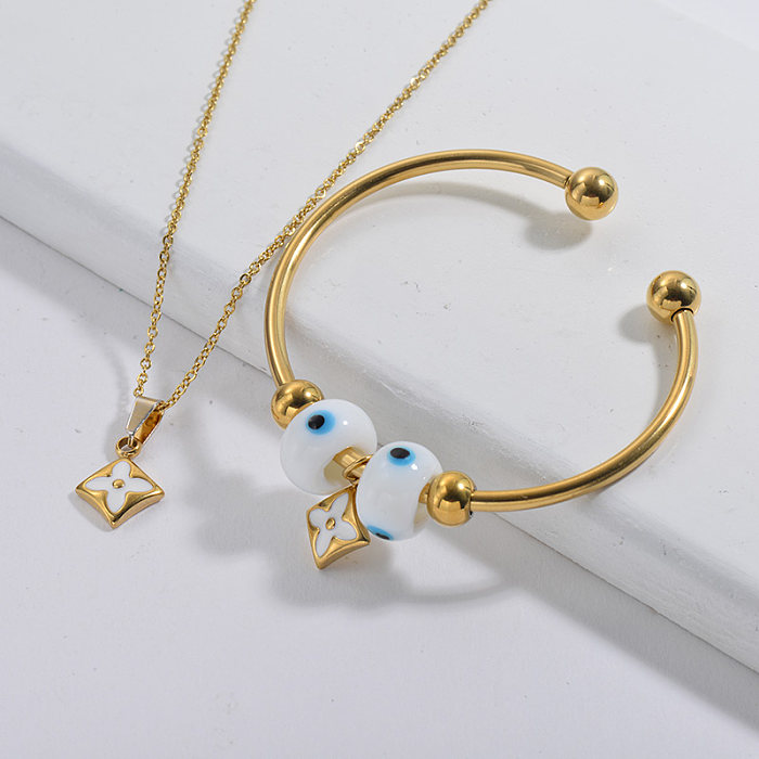 Conjunto de joyas de brazalete de collar de flor chapado en oro de marca famosa de acero inoxidable