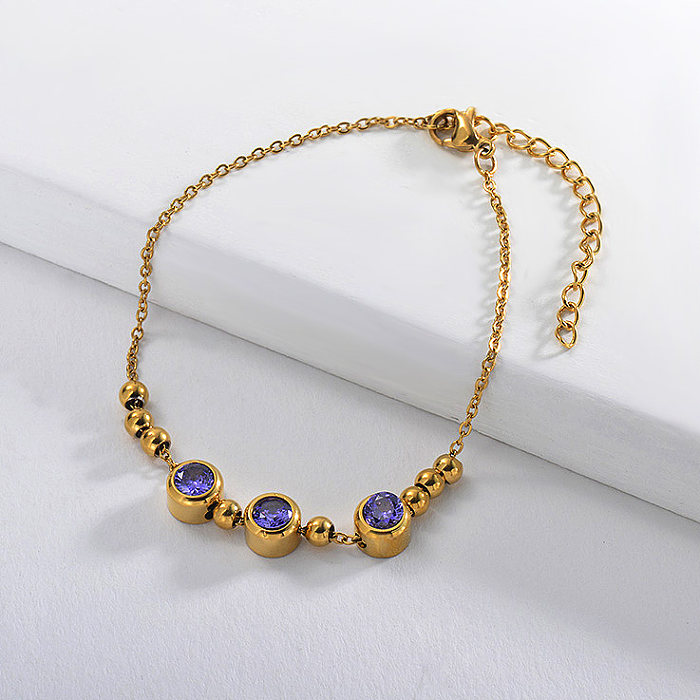 Gold stainless steel steel ball bracelet with purple zircon pendant
