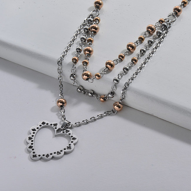 Collier de chaîne en couches de perles de double couleurs de coeur creux d'acier inoxydable d'argent pour des femmes