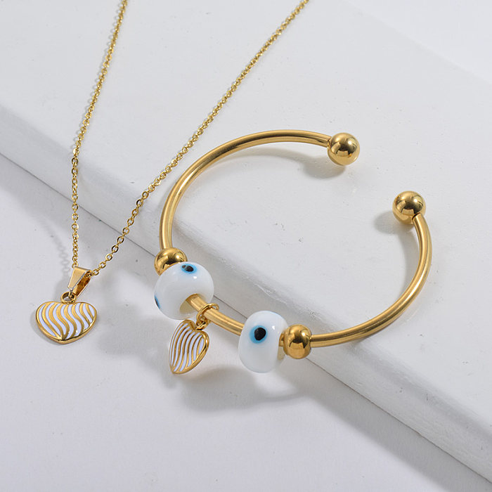 Conjunto de joyería de brazalete de collar de encanto de oído chapado en oro de marca famosa de acero inoxidable