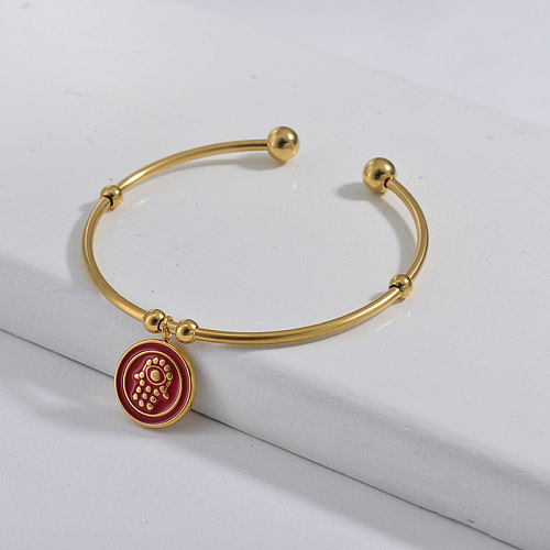 Simple style golden stainless steel bracelet with red dripping hamsa hand pendant