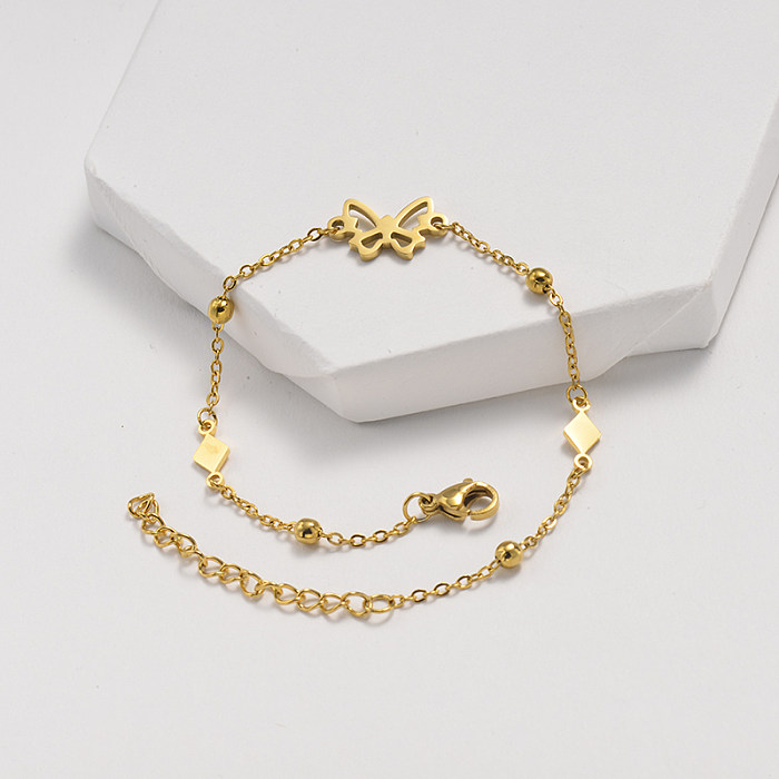 Bracelete de corrente com bola de aço e ouro em aço inoxidável com pendente em forma de borboleta oca