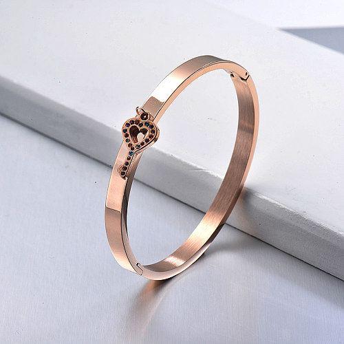 Rose gold stainless steel bracelet with colorful zircon key pendant