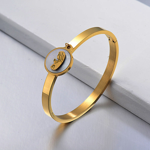 Golden stainless steel solid bracelet with round white shell pendant