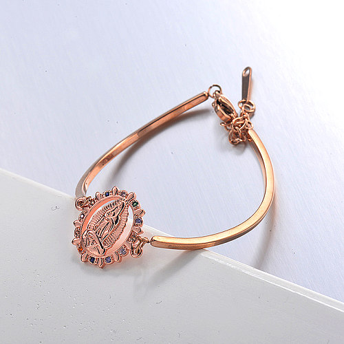 Rose gold stainless steel open bracelet with saint pendant