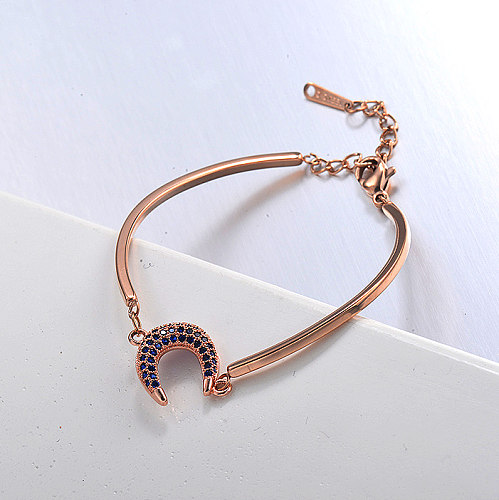 Rose gold stainless steel open bracelet with blue zircon pendant