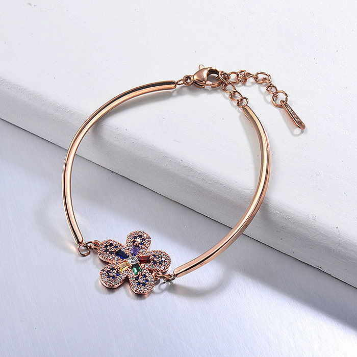 Bracelete aberta em ouro rosa de aço inoxidável com pendente de flor de zircão azul