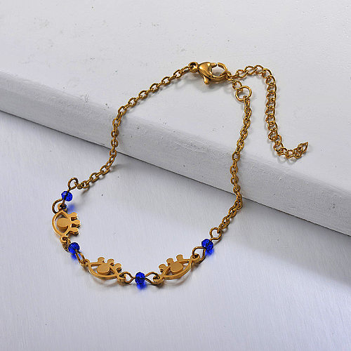 Bracelet with golden stainless steel eyes and blue crystal beads