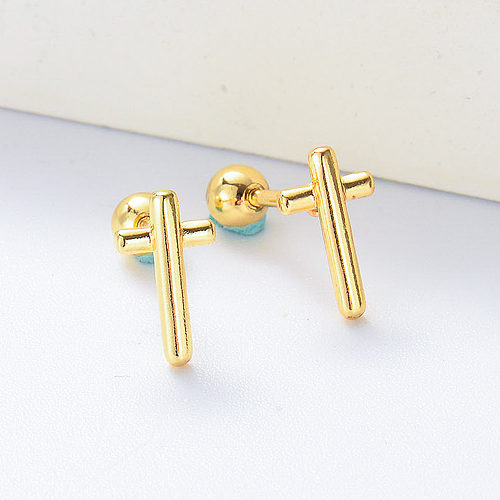 Pendientes mini piercing cruz chapados en oro