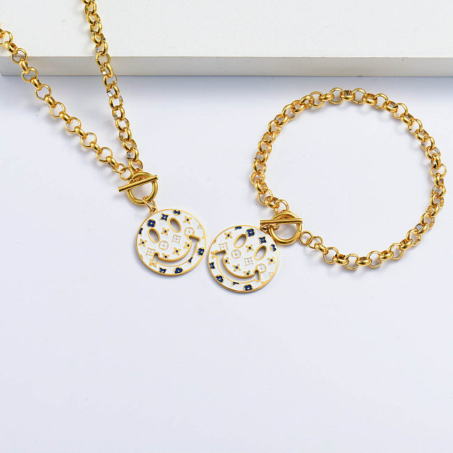 gold plated white smily bracelet and necklace set