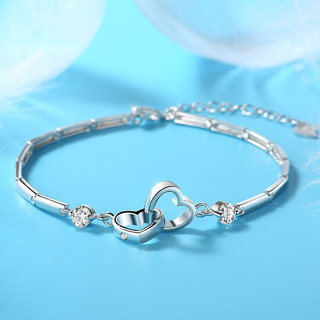 Pulseras simples de doble corazón chapadas en plata para mujer.