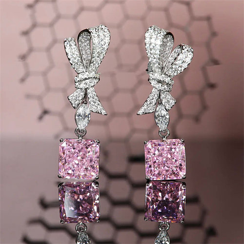 Pendientes de lazo de diamantes de cuarzo rosa para mujer