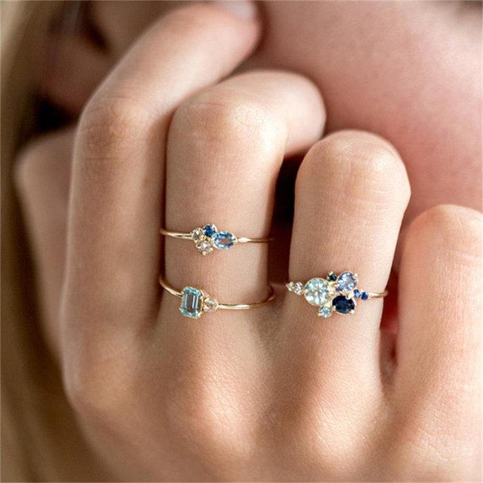 set of gold rings with aquamarine for women