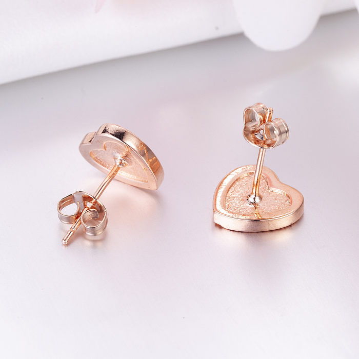 Pendientes de corazón de diamantes de oro rosa de 18 quilates para mujer.