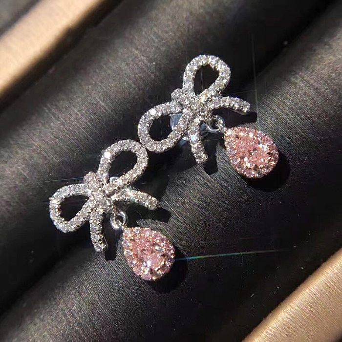 Bonitos aretes de cuarzo rosa con lazo de diamantes para mujer