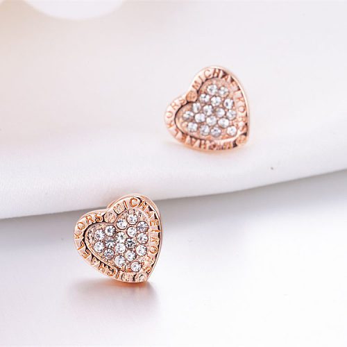 Pendientes de corazón de diamantes de oro rosa de 18 quilates para mujer.