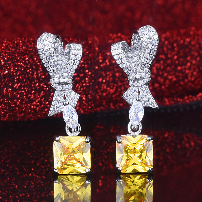 Boucles d'oreilles avec nœud en diamant et quartz rose pour femme