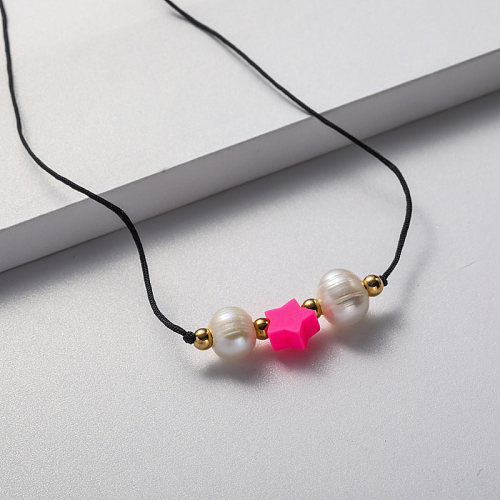 pink pendant and pearl black string necklace