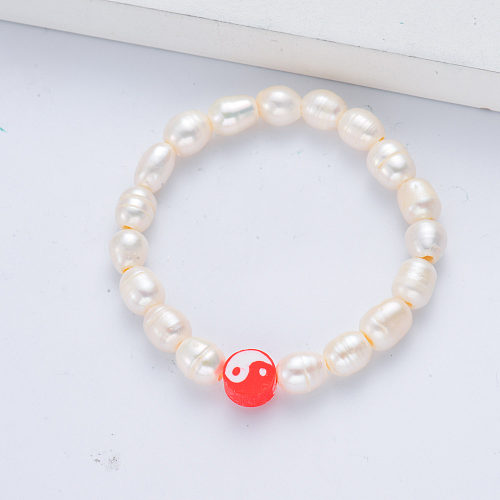 Armband mit weißer Perle und rotem Anhänger für Damen