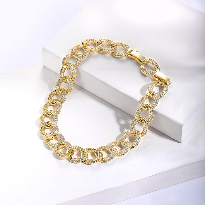 Brazalete de cadena chapado en oro real de latón con joyas de circonita