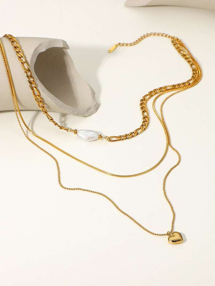 Minimalistische mehrsträngige Halskette aus Edelstahl mit Süßwasserperlenherzen