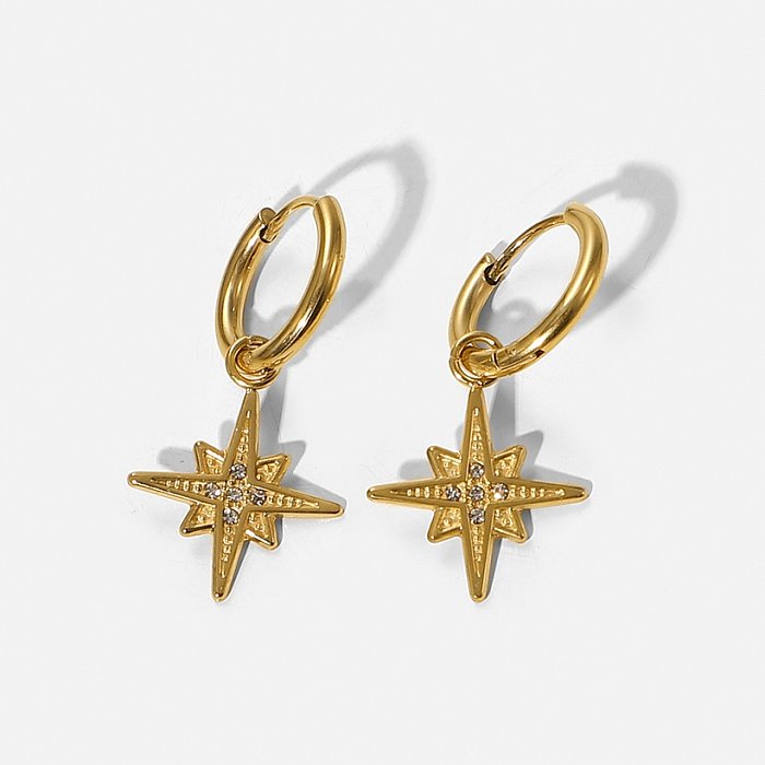Boucles d'oreilles pendantes cinq zircons incrustées d'une étoile à huit branches en or 14 carats