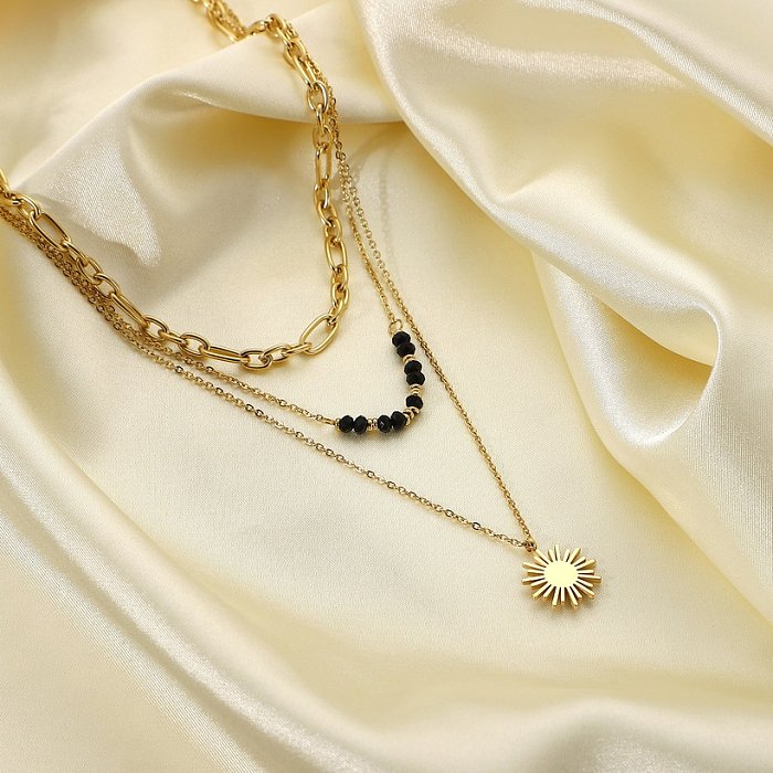 Art und Weisekontrastfarbe schwarze Reisperlen-Sonnenblumenanhänger dreischichtige Halskette