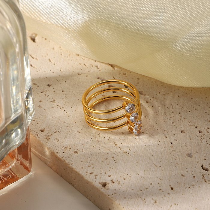 Joyería de anillo de acero inoxidable chapado en oro de 4 quilates con 18 diamantes de circonio blanco europeo y americano