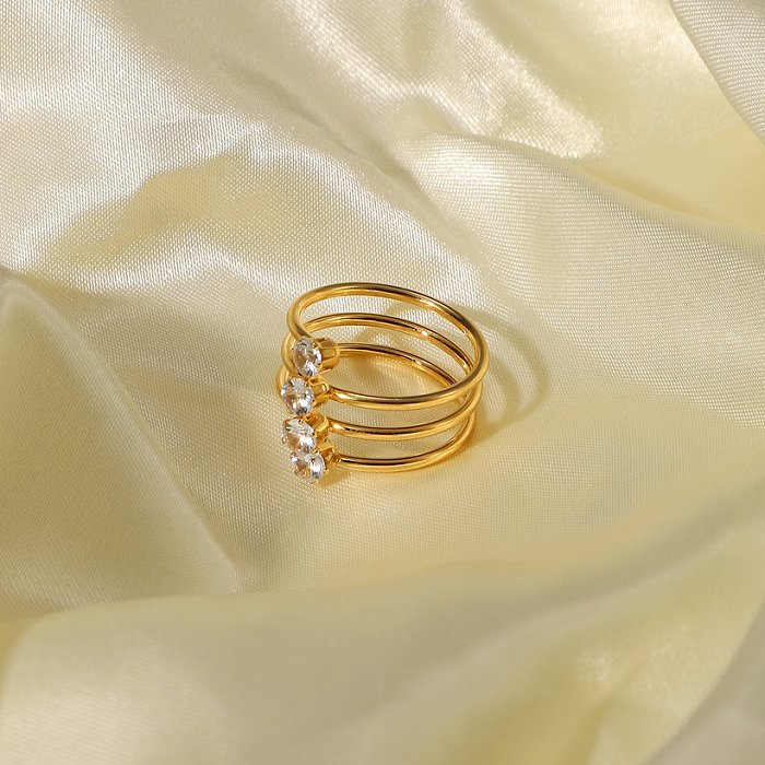 Joyería de anillo de acero inoxidable chapado en oro de 4 quilates con 18 diamantes de circonio blanco europeo y americano